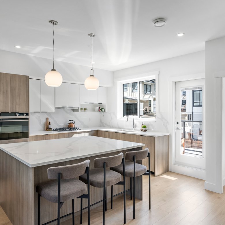 Modern kitchen with quartz counters at Signature Townhomes Surrey.