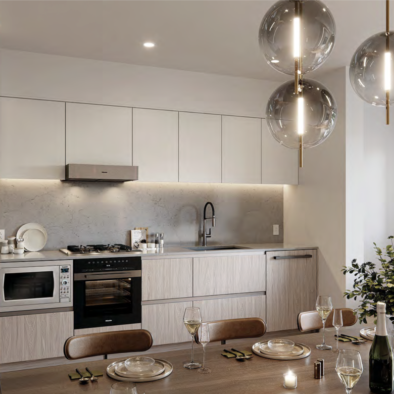 Modern kitchen interior with quartz counters and integrated appliances.