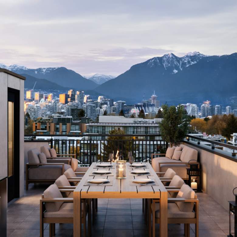 rooftop at Kinsley with seating, greenery and view of downtown.